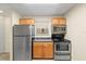 Efficient kitchen with stainless steel appliances, compact design, and good lighting at 2500 Winding Creek Blvd # I106, Clearwater, FL 33761