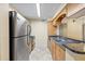Functional kitchen offering stainless steel appliances, granite counters, and wood cabinets at 2500 Winding Creek Blvd # I106, Clearwater, FL 33761