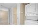 Stacked washer and dryer next to a closet, in a dedicated laundry area at 2500 Winding Creek Blvd # I106, Clearwater, FL 33761