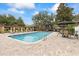 Inviting community pool with lounge chairs, tables, and well-maintained surroundings at 2500 Winding Creek Blvd # I106, Clearwater, FL 33761