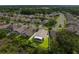 A single-story home with a screened-in porch and expansive lawn; a great spot for outdoor living at 252 Arbor Woods Cir, Oldsmar, FL 34677