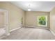 Bedroom featuring neutral carpet, a high ceiling, and a glass door leading to an outdoor space at 252 Arbor Woods Cir, Oldsmar, FL 34677