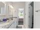 Bathroom boasts a double vanity and seamless access to the bedroom at 25487 Dan Brown Hill Rd, Brooksville, FL 34602
