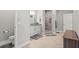 Bright bathroom featuring a walk-in shower, granite-topped vanity, and neutral tile at 25487 Dan Brown Hill Rd, Brooksville, FL 34602