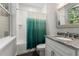 Bathroom featuring tub, shower with a decorative shower curtain and granite vanity at 25487 Dan Brown Hill Rd, Brooksville, FL 34602