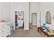 Bedroom featuring organized closet, natural light, and access to another room at 25487 Dan Brown Hill Rd, Brooksville, FL 34602