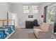 Bedroom with natural light, ceiling fan, and doorway to bathroom at 25487 Dan Brown Hill Rd, Brooksville, FL 34602