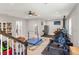 This is a spacious home gym with weightlifting equipment, mats, and a ceiling fan at 25487 Dan Brown Hill Rd, Brooksville, FL 34602