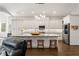 Modern kitchen with stainless steel appliances, granite countertops, and a large center island with seating at 25487 Dan Brown Hill Rd, Brooksville, FL 34602