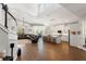 Spacious open-concept living room with hardwood floors and views of the modern kitchen and dining area at 25487 Dan Brown Hill Rd, Brooksville, FL 34602