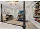 Large main bedroom with home office area, ceiling fan, and access to a home gym at 25487 Dan Brown Hill Rd, Brooksville, FL 34602