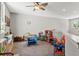 Spacious playroom with ceiling fan, natural light, and ample space for play and imagination at 25487 Dan Brown Hill Rd, Brooksville, FL 34602