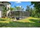 Screened pool with ample decking offers refreshing outdoor enjoyment at 25487 Dan Brown Hill Rd, Brooksville, FL 34602