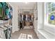 Spacious walk-in closet with built-in shelving, drawers, and a window seat at 25487 Dan Brown Hill Rd, Brooksville, FL 34602