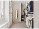 Well-organized walk-in closet with custom shelving, drawers, mirror, and ample storage space at 25487 Dan Brown Hill Rd, Brooksville, FL 34602