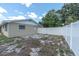 Backyard with a white vinyl fence at 2954 Leisure Ct, Dunedin, FL 34698