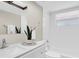 Bright bathroom features a shower-tub combo and modern fixtures at 2954 Leisure Ct, Dunedin, FL 34698