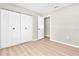 Clean bedroom with good closet space and wood-look flooring at 2954 Leisure Ct, Dunedin, FL 34698