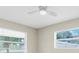 Bedroom featuring neutral colors, ceiling fan and lots of natural light at 2954 Leisure Ct, Dunedin, FL 34698