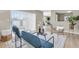 Open living area with comfortable seating, area rug, and sliding glass doors bringing in natural light at 2954 Leisure Ct, Dunedin, FL 34698