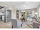 Open-concept layout with a view of stainless steel kitchen appliances and sliding glass doors to the backyard at 2954 Leisure Ct, Dunedin, FL 34698