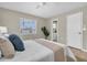 Serene bedroom features a cozy bed with soft pillows, a ceiling fan, and a view of the outdoors at 2954 Leisure Ct, Dunedin, FL 34698