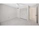 Bedroom with a ceiling fan, a double closet and an ensuite, ideal for comfort and convenience at 3134 Lake Pine Way # F2, Tarpon Springs, FL 34688