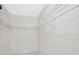 Walk-in closet with wire shelving providing ample storage space for clothing and accessories at 3134 Lake Pine Way # F2, Tarpon Springs, FL 34688