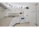 Classic kitchen with all white cabinets and appliances at 3134 Lake Pine Way # F2, Tarpon Springs, FL 34688