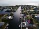 Aerial view showcasing the waterfront property's canal access and proximity to open water at 3336 Gulfview Dr, Hernando Beach, FL 34607