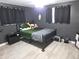 Bedroom featuring a bed with black metal frame and dark gray walls at 3336 Gulfview Dr, Hernando Beach, FL 34607