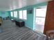 Bonus room featuring gray wood floors and access to pool at 3336 Gulfview Dr, Hernando Beach, FL 34607