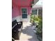 Cozy front porch with charming decor and seating, inviting guests to relax and enjoy the outdoor ambiance at 3336 Gulfview Dr, Hernando Beach, FL 34607