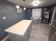Bright kitchen featuring a central island, dining area, and stainless steel appliances at 3336 Gulfview Dr, Hernando Beach, FL 34607