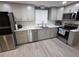 Updated kitchen featuring stainless steel appliances, modern cabinetry, and sleek countertops at 3336 Gulfview Dr, Hernando Beach, FL 34607