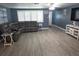 Spacious living room boasts gray sectional sofa, neutral walls, and window shutters, creating a comfortable atmosphere at 3336 Gulfview Dr, Hernando Beach, FL 34607