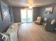 Living room featuring neutral walls, wicker chairs and view to the frosted glass patio doors at 3336 Gulfview Dr, Hernando Beach, FL 34607