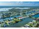 Waterfront community featuring charming houses along canal, offering stunning coastal living with easy access to the ocean at 3363 Poinsettia Dr, Hernando Beach, FL 34607
