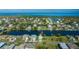 Waterfront community featuring charming houses along canal, offering stunning coastal living with easy access to the ocean at 3363 Poinsettia Dr, Hernando Beach, FL 34607