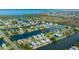 Wide aerial shot of homes in a waterfront community with ocean access and winding waterways at 3363 Poinsettia Dr, Hernando Beach, FL 34607