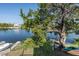 Tranquil backyard with waterfront views and a dock, surrounded by lush greenery at 3363 Poinsettia Dr, Hernando Beach, FL 34607