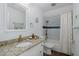 Updated bathroom with granite countertop, gold fixtures, and tiled shower at 3363 Poinsettia Dr, Hernando Beach, FL 34607