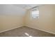 Bright bedroom with neutral carpet features a window for natural light at 3363 Poinsettia Dr, Hernando Beach, FL 34607