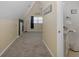 A cozy bedroom featuring neutral walls and carpet, vaulted ceilings and beachy decor at 3363 Poinsettia Dr, Hernando Beach, FL 34607
