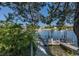 Waterfront property featuring a private wooden dock perfect for boating and enjoying serene water views at 3363 Poinsettia Dr, Hernando Beach, FL 34607
