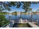 Waterfront property featuring a private wooden dock perfect for boating and enjoying serene water views at 3363 Poinsettia Dr, Hernando Beach, FL 34607