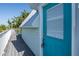 Exterior of home, including deck, siding, and blue door to storage area at 3363 Poinsettia Dr, Hernando Beach, FL 34607