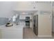 Modern kitchen with stainless steel appliances, white cabinets, and quartz countertops at 3363 Poinsettia Dr, Hernando Beach, FL 34607