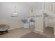 Open-concept space with high ceilings, fan, and modern decor near kitchen at 3363 Poinsettia Dr, Hernando Beach, FL 34607