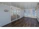Spacious sunroom featuring wood floors, neutral paint and sliding glass doors at 3363 Poinsettia Dr, Hernando Beach, FL 34607